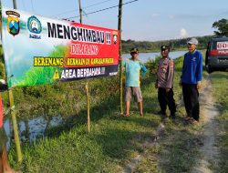 Pemasangan Bener Himbauan Larangan Bermain Atau Berenang di Saluran Irigasi Waduk Desa Kuripan